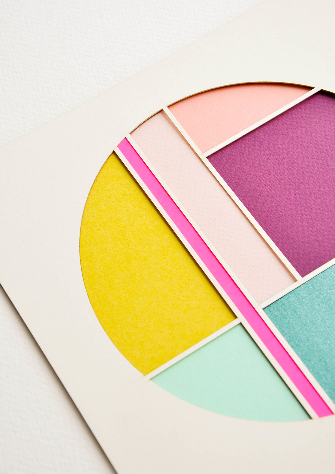 Detail of laser cut design showing colorblocked circle