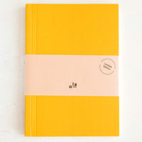 Small / Mustard / Dot Grid: A small yellow notebook.