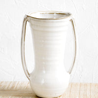 1: Glossy ceramic vase with hourglass silhouette and slim handles along sides