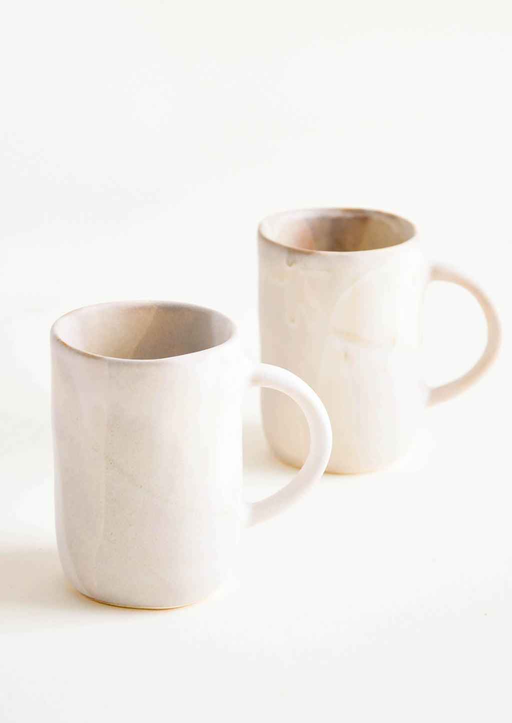 Stonewash: Ceramic mugs with handle, shown in matte watercolor glaze.