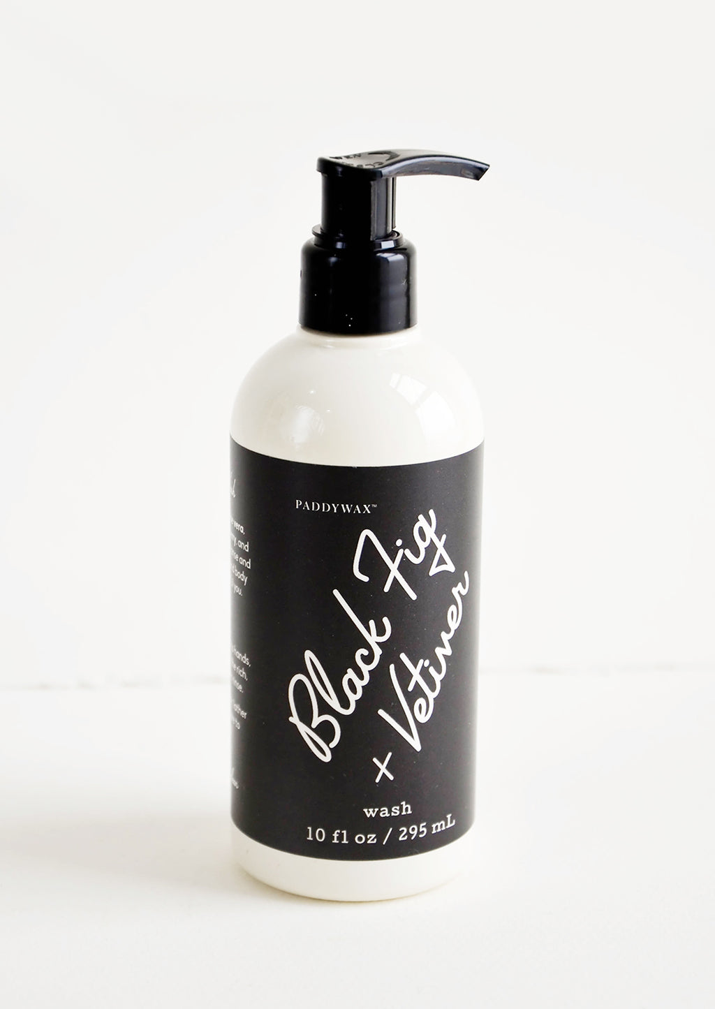 Black Fig & Vetiver: Liquid soap packaged in ivory and black pump bottles with black and white label