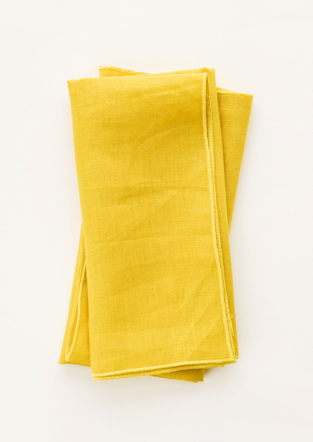 Sunshine: Pair of folded Linen Napkins in Yellow.
