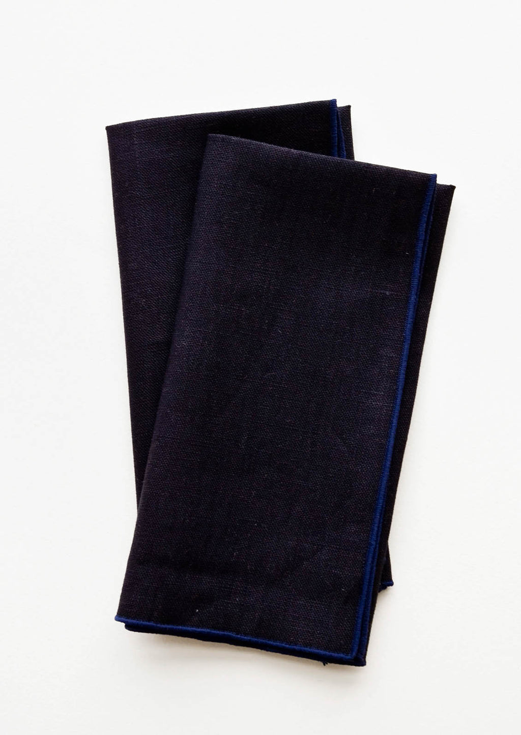 Ink Blue: Pair of folded Linen Napkins in Navy Blue.