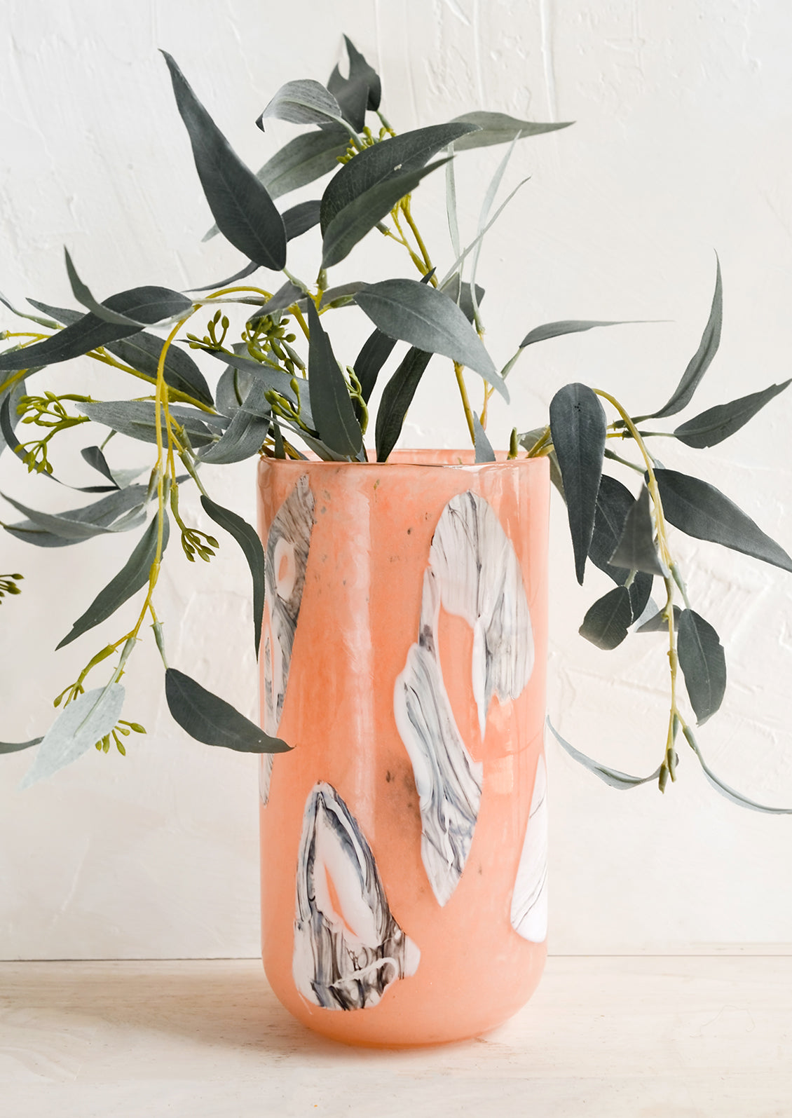 Vase with eucalyptus.