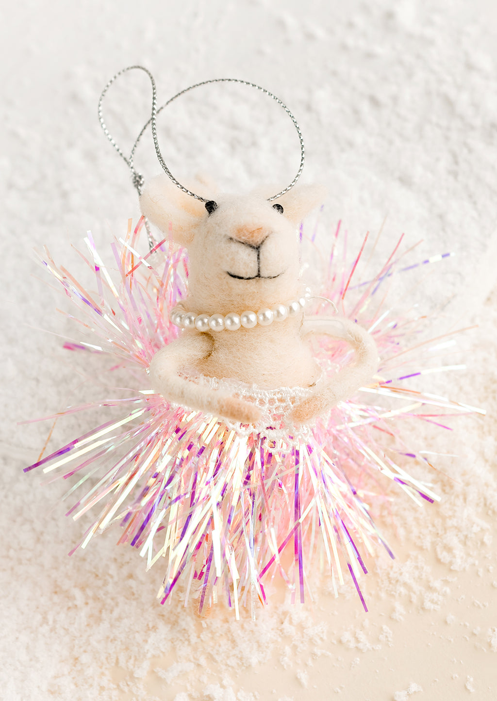 1: A felted holiday ornament of a mouse wearing a glittery tutu.