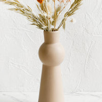 Rose Cream: A blush ceramic bud vase with tapered shape.