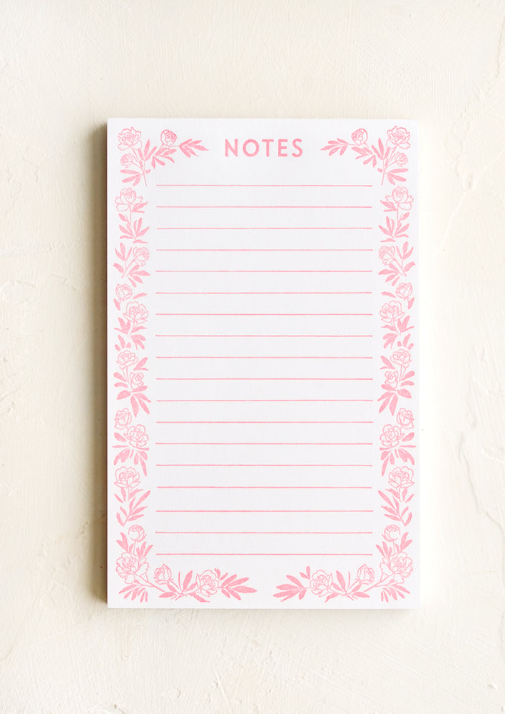 A letterpress printed, lined notepad with peony border and "NOTES" printed at top.
