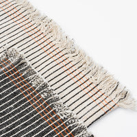 1: Table runners with frayed edges. Black and white pinstripe with orange stitching detail.