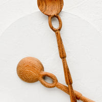 1: Two wooden spoons with unique shaker-inspired carved design.