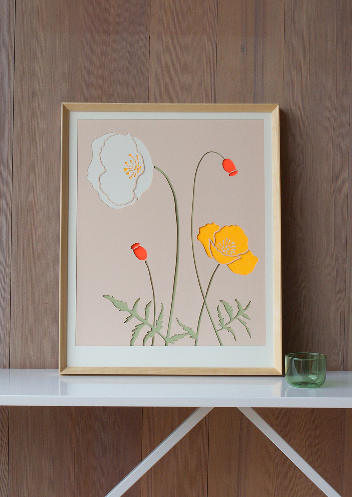A lasercut art print depicting poppy flowers on blush background.