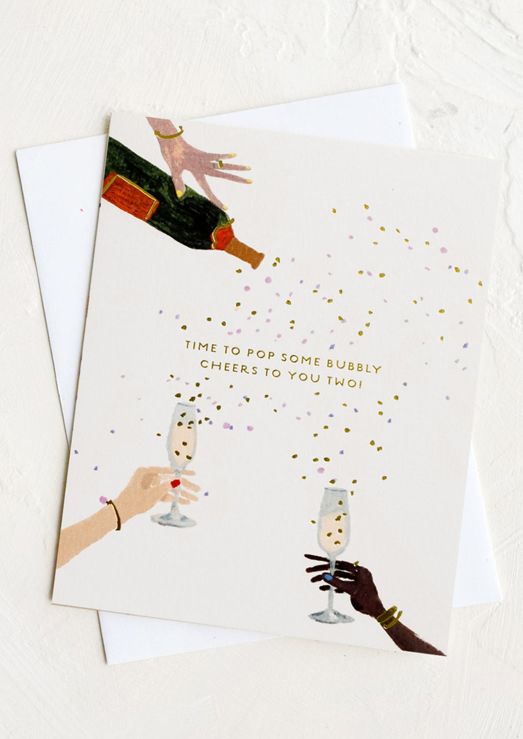 1: A greeting card with images of hands holding champagne glasses.