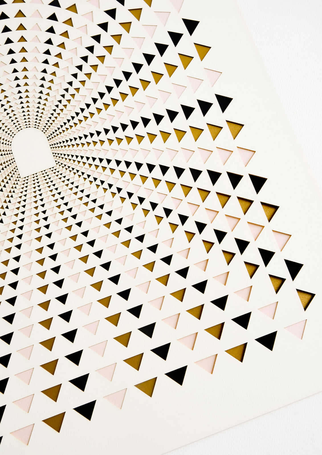 Detail of lasercut triangles in pink, brown and balack