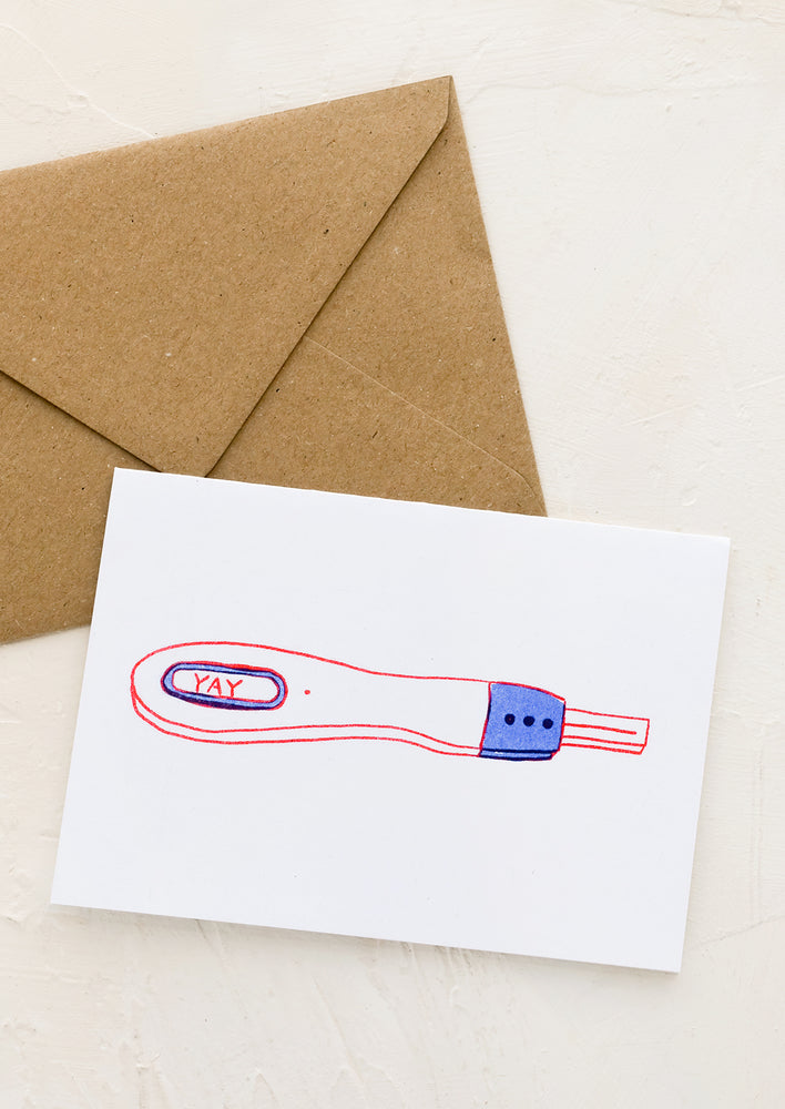 1: A greeting card with illustration of pregnancy test with window reading "YAY".