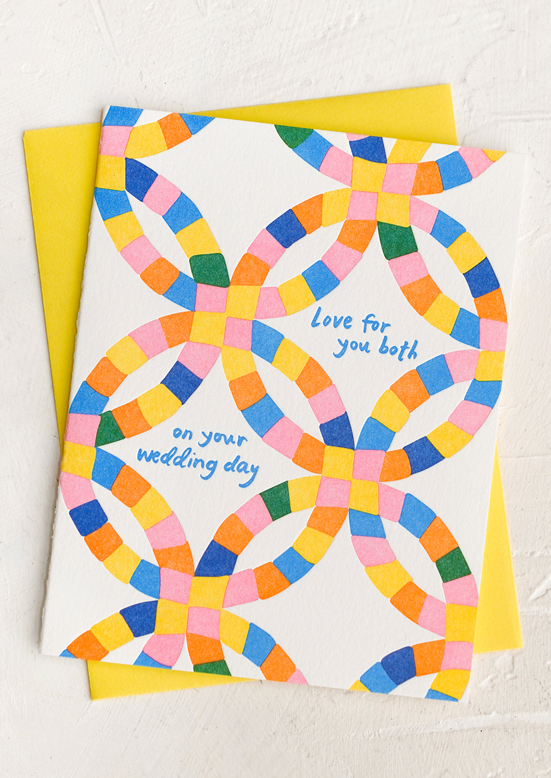 A greeting card reading "Love for you both on your wedding day".