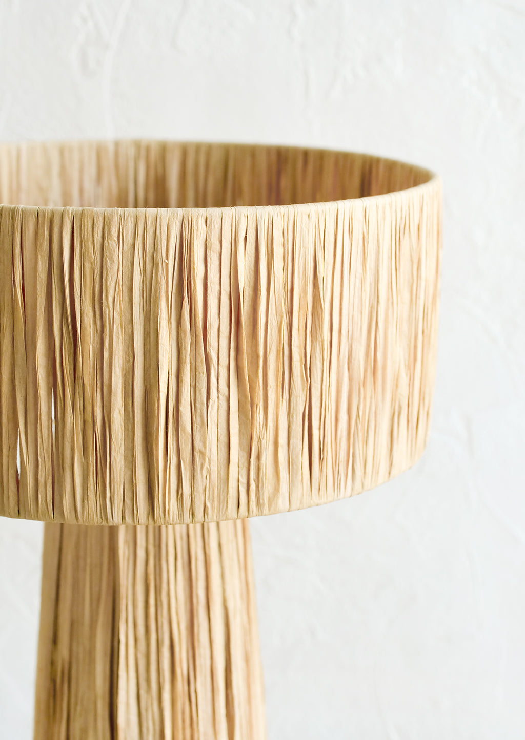 4: A table lamp wrapped in natural raffia.