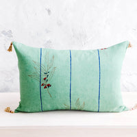 1: Decorative lumbar throw pillow in jade green linen with blue stripes and block printed floral detail