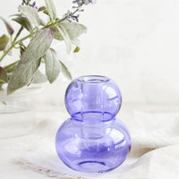 Taro: A bubble shaped glass taper candle holder in purple.