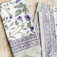 1: A pair of block printed cotton napkins in green and purple floral print.