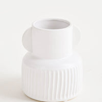 Regular: Whimsical, white ceramic vase with ribbed texture around base