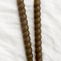 Truffle: Two twisted taper candles in truffle brown.