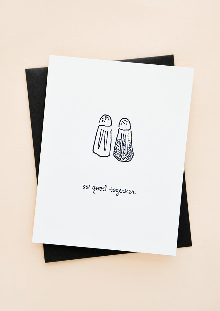 1: Greeting card with letterpress printed salt and pepper shakers, black cursive reads "So good together". With black envelope.