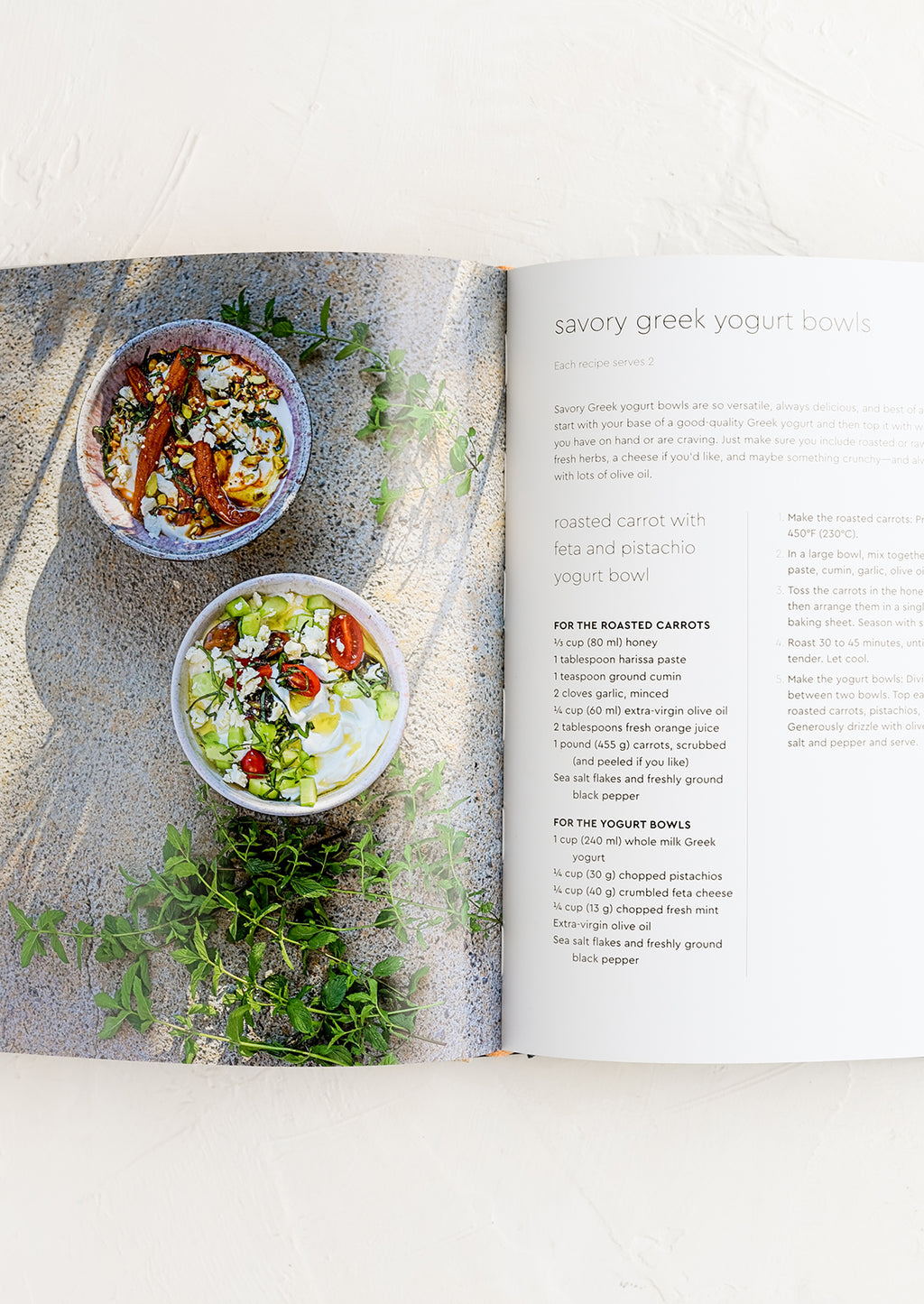 2: A cookbook open to a page with recipe for savory greek yogurt bowls.