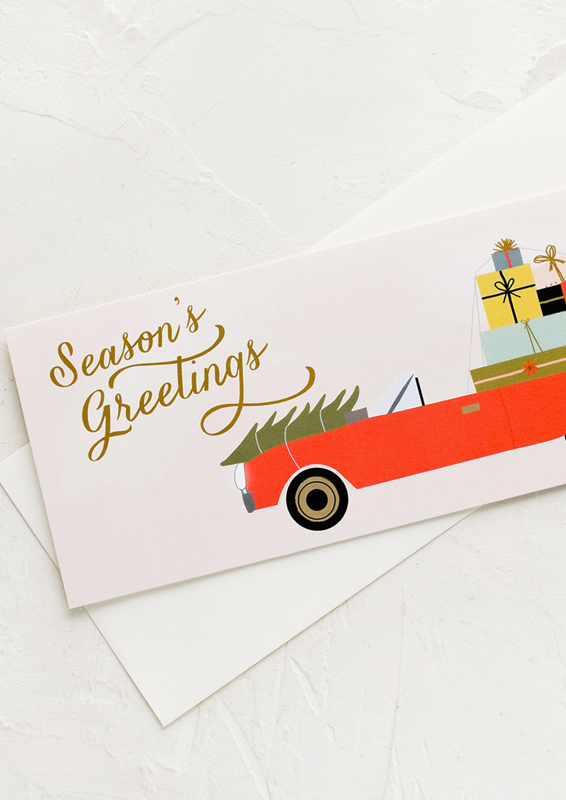 Rectangular greeting cards with car full of presents, text reads "Season's greetings".