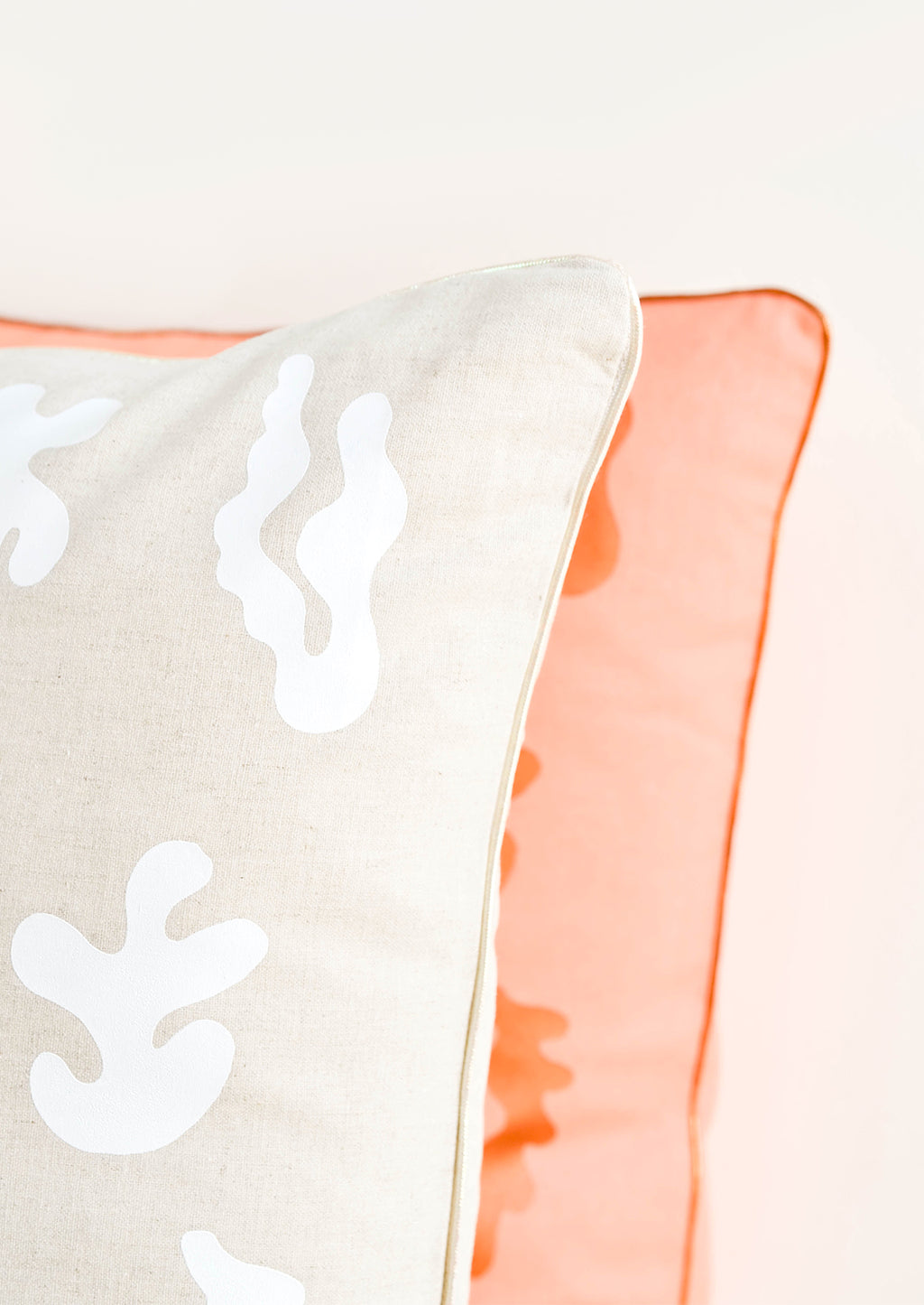2: Close up of metallic and iridescent trim detail on printed throw pillows