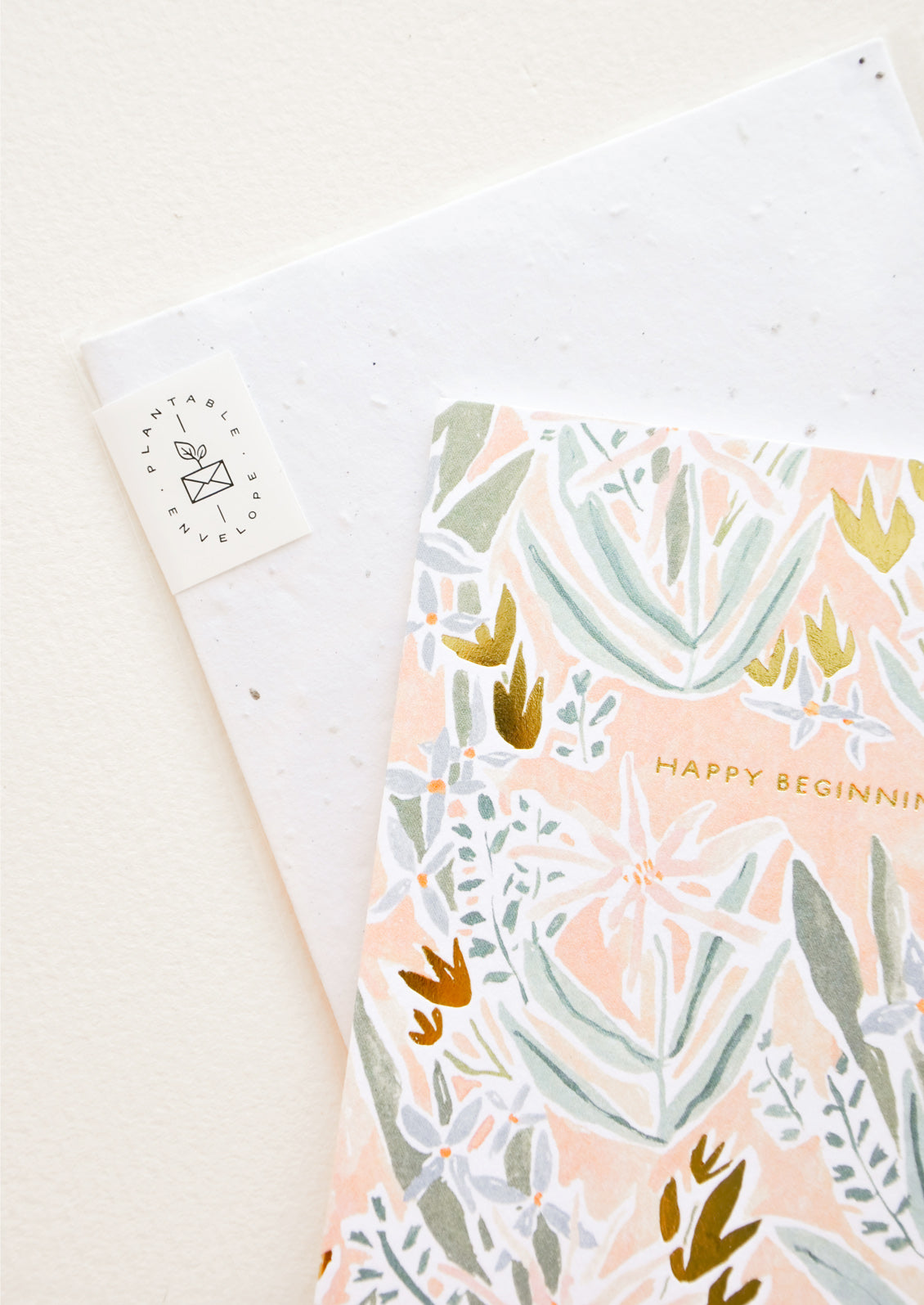 Copper text detailing on floral print greeting card