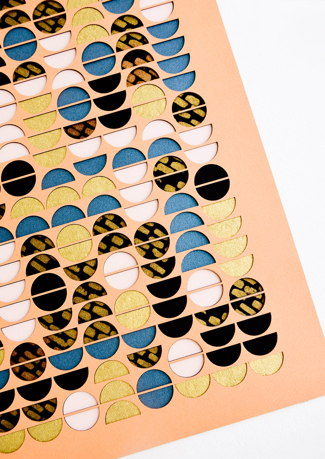 Artwork with semi-circle cutouts in metallic colors and patterns