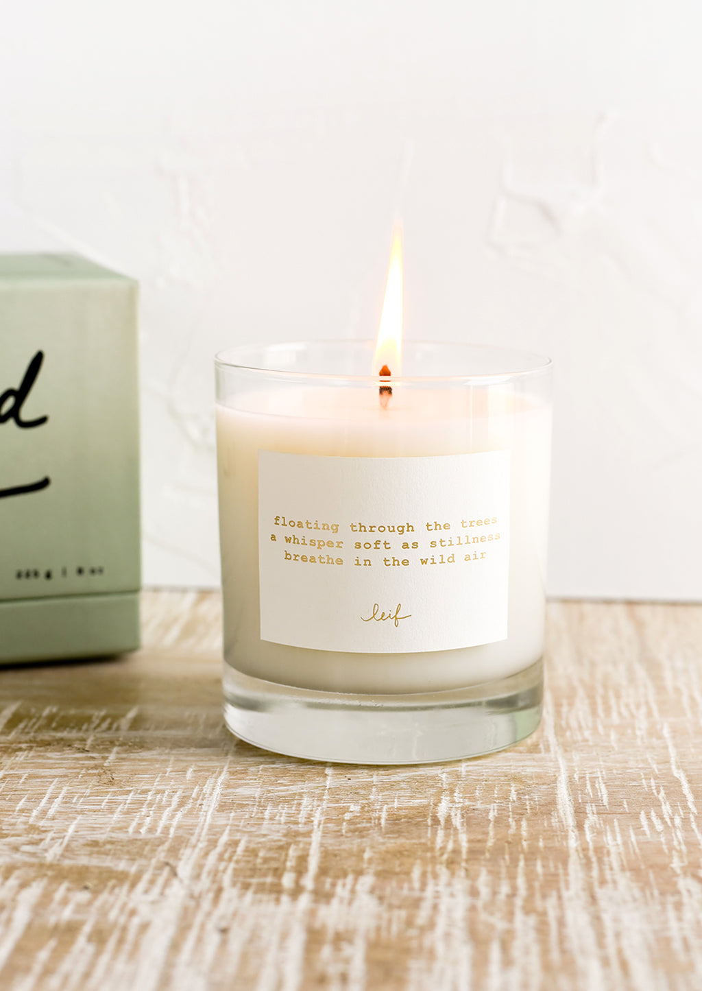 Wild Air: A jar candle with haiku print label.