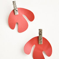 Sienna / Silver Spot: Post earrings with red asymmetric leaf shape hanging from small speckled rectangle.