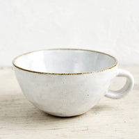 Glossy White / Latte Mug: A ceramic latte mug in a glossy white glaze with soft speckles.