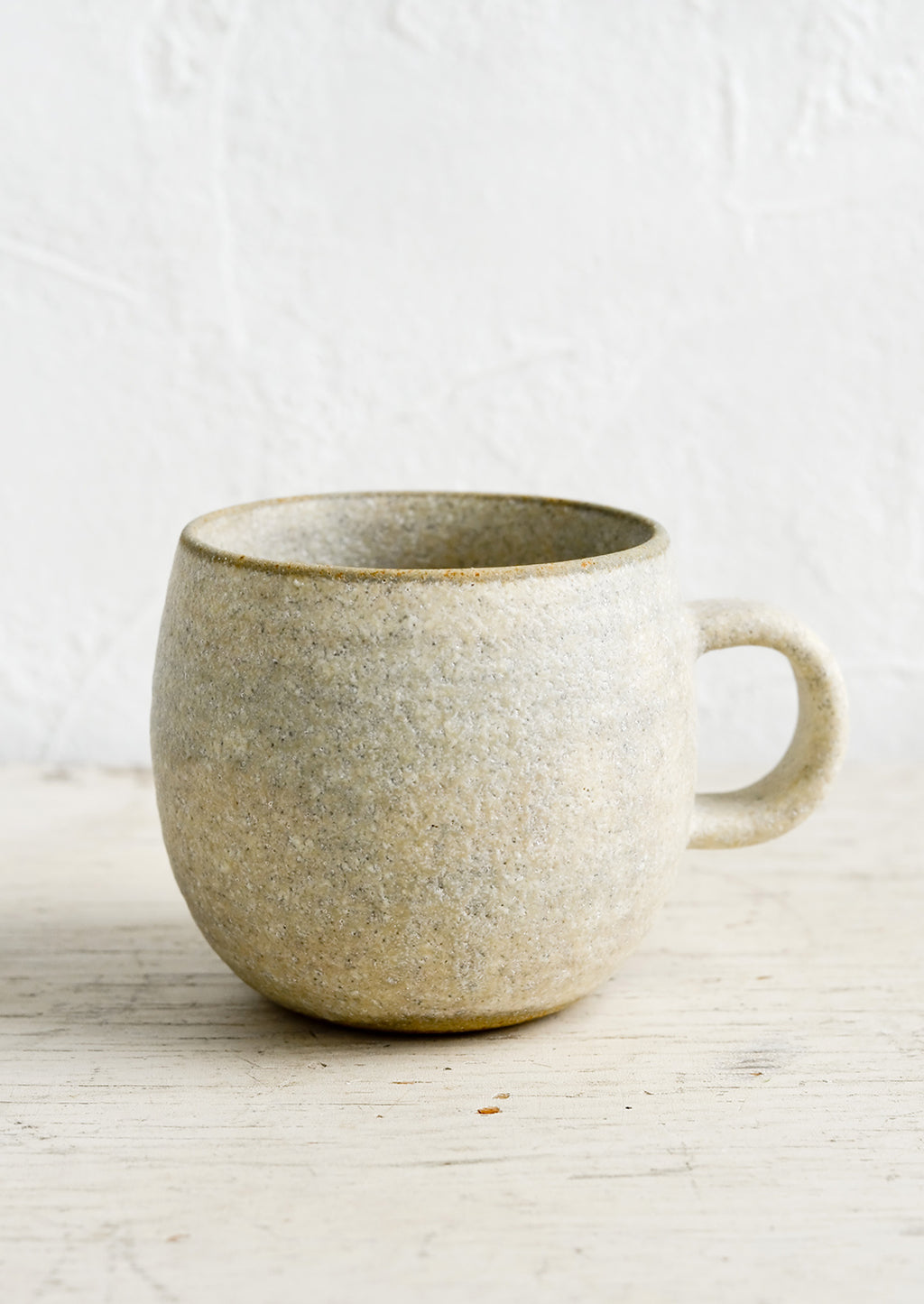 Matte Grey / Standard Mug: A ceramic coffee mug in a rustic, textured sandy glaze.