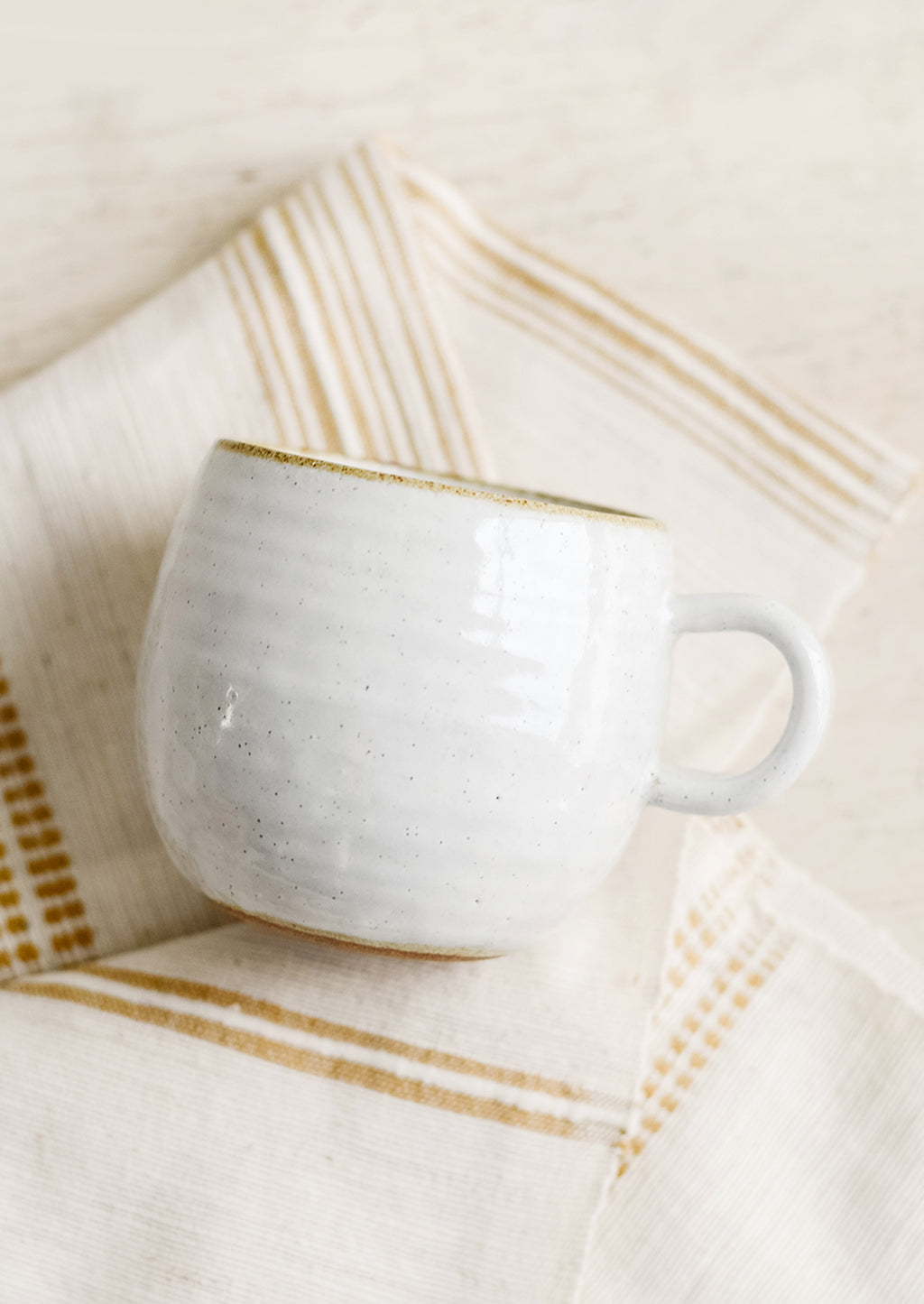 Glossy White / Standard Mug: A round coffee mug in softly speckled glossy white glaze.