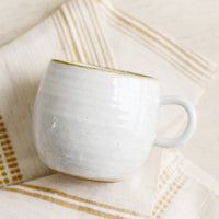 Glossy White / Standard Mug: A round coffee mug in softly speckled glossy white glaze.