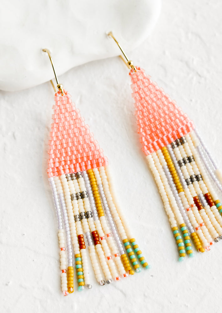 1: A pair of beaded earrings in pink multicolor.