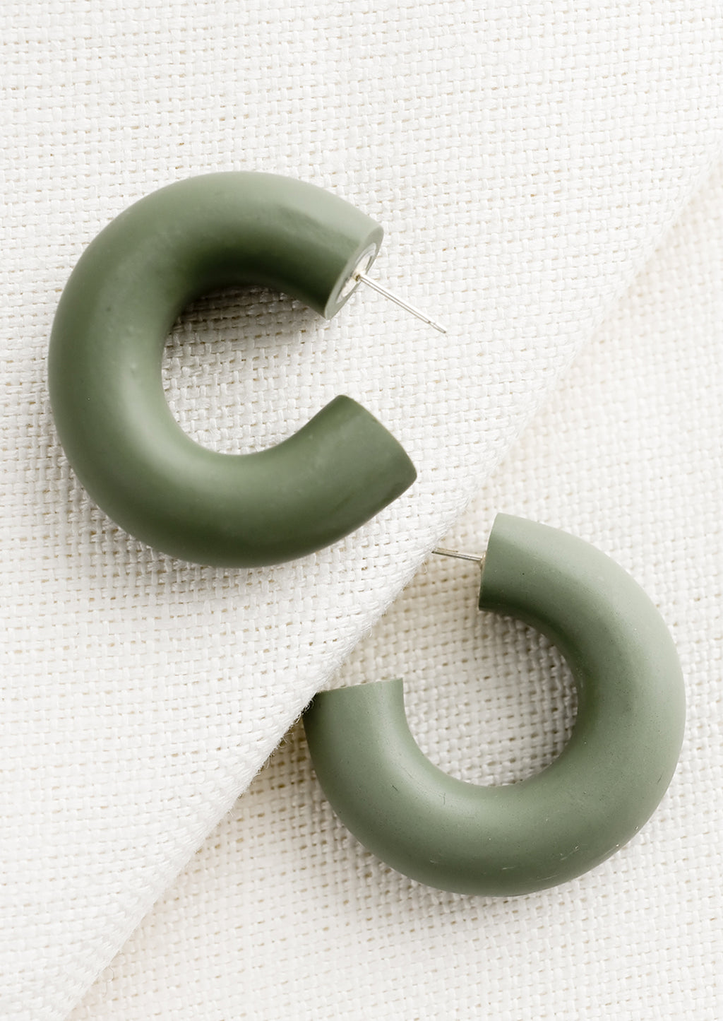 Aloe: A pair of polymer clay hoop earrings in aloe green..
