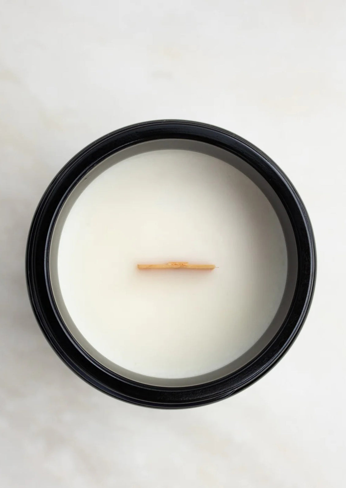 A candle with wooden wick.