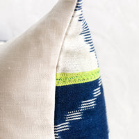 5: A vintage indigo baule fabric pillow in dark indigo with lime green stripes.