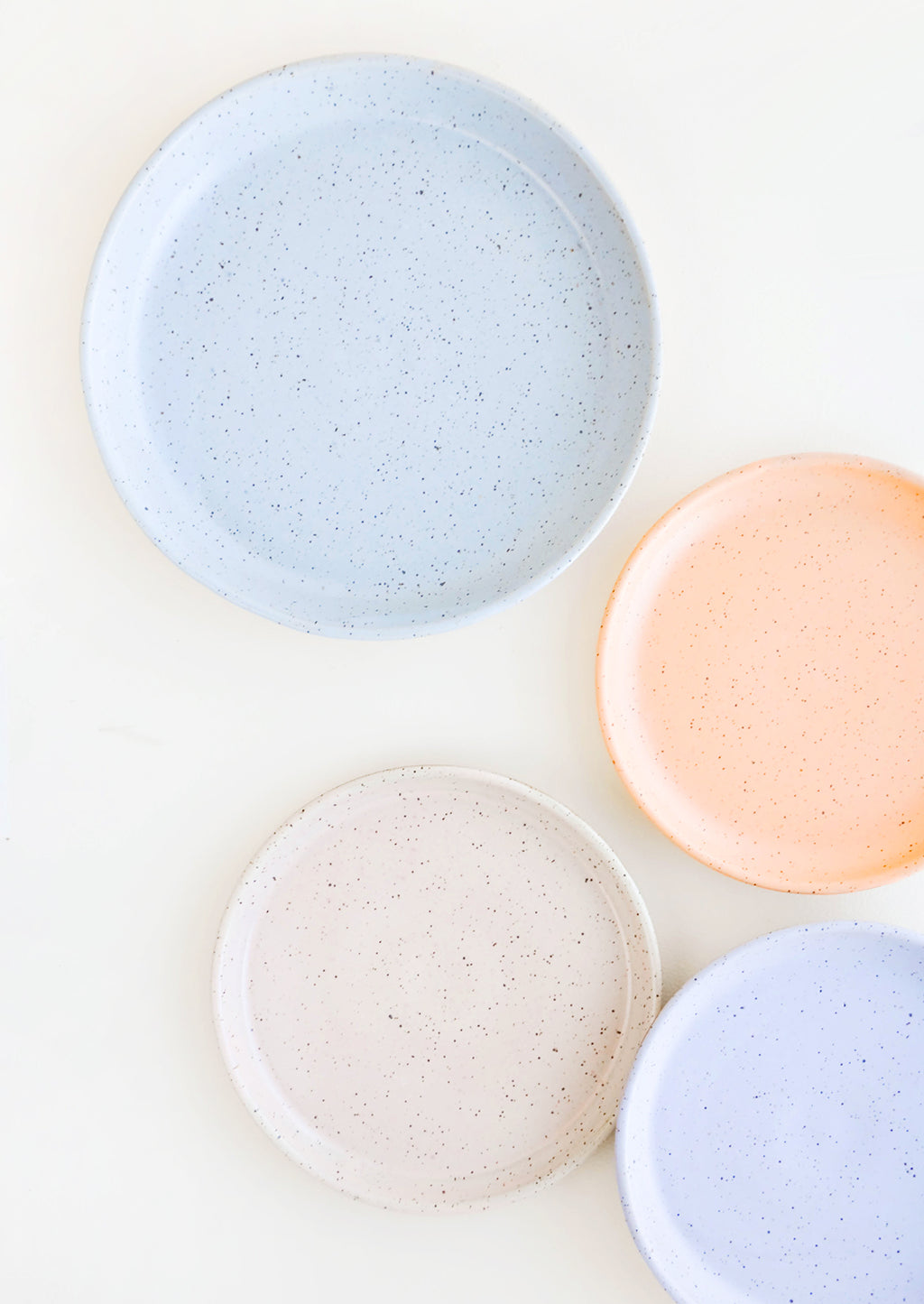 2: Four Speckled Ceramic Salad & Dinner Plates in blue, orange, pink and purple.