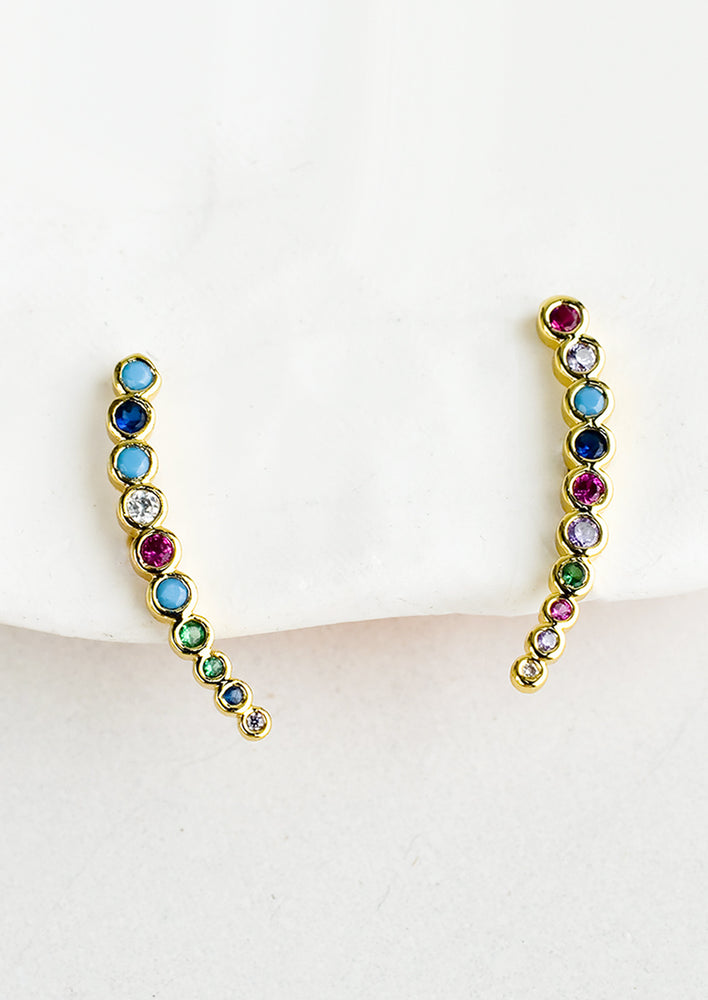 1: A pair of tapered climber earrings with multicolor bezel set crystals.