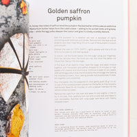 3: A cookbook open to a page with recipe for Golden saffron pumpkin cake.