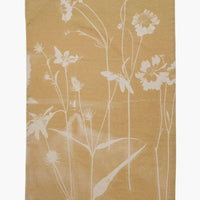 No. 2: A yellow cotton tea towel with "bleached" look floral print.