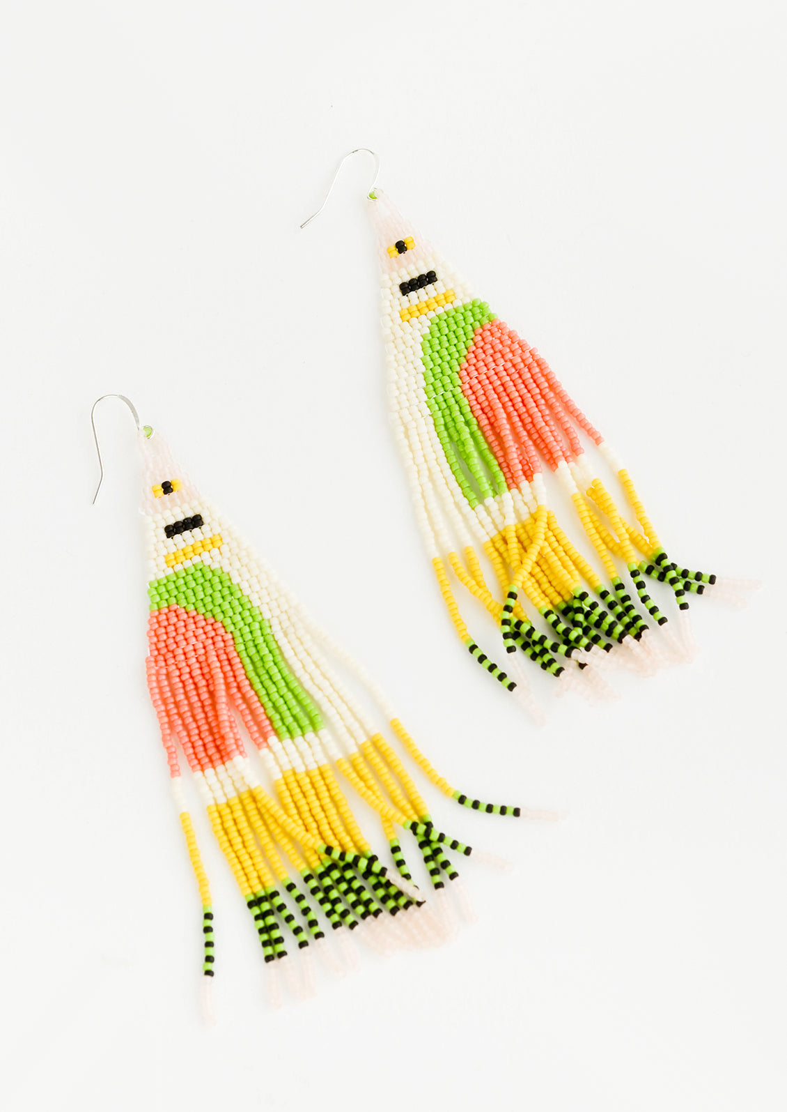 Ivory, lime green, pink, yellow, and black beaded fringe earrings on silver ear wire.