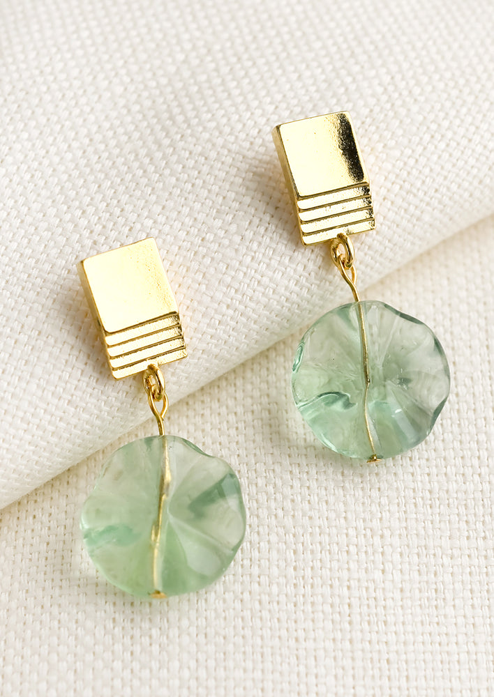 1: A pair of earrings with rectangular gold post and circular green flourite.