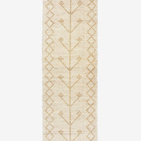 3: A seagrass runner rug in neutral color with talisman pattern and diamond border.