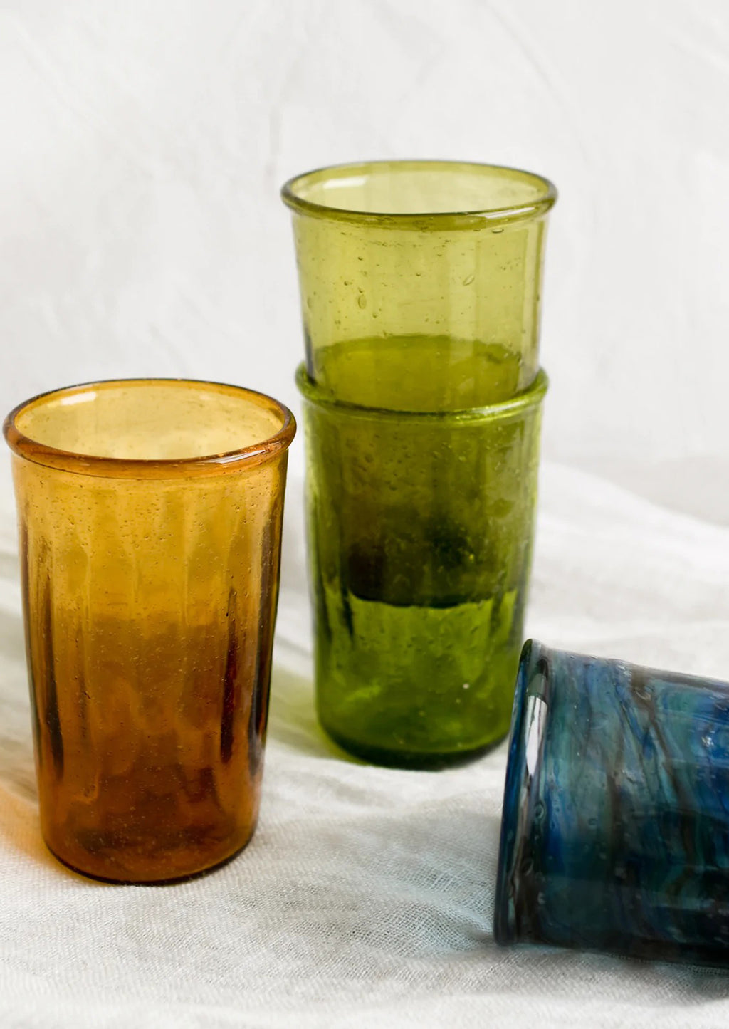 2: Colorful tumblers in translucent glass in assorted colors.