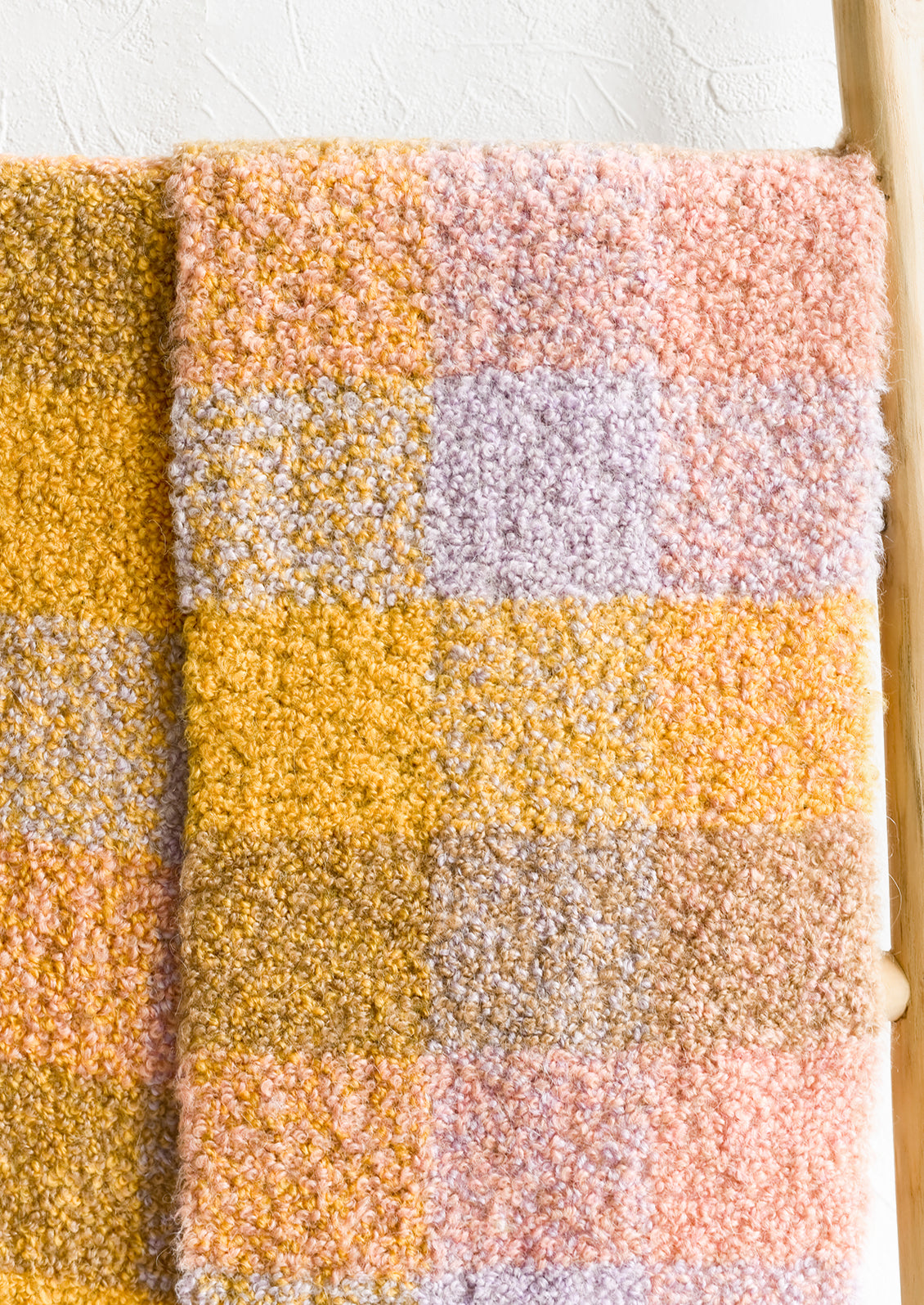 A teddy textured scarf in pastel check print.