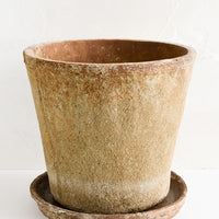 Large: A rustic, heavily textured terracotta clay planter with saucer.